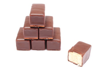Stack of chocolate sweets on white background