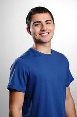 Smiling boy smiling wearing blue t-shirt