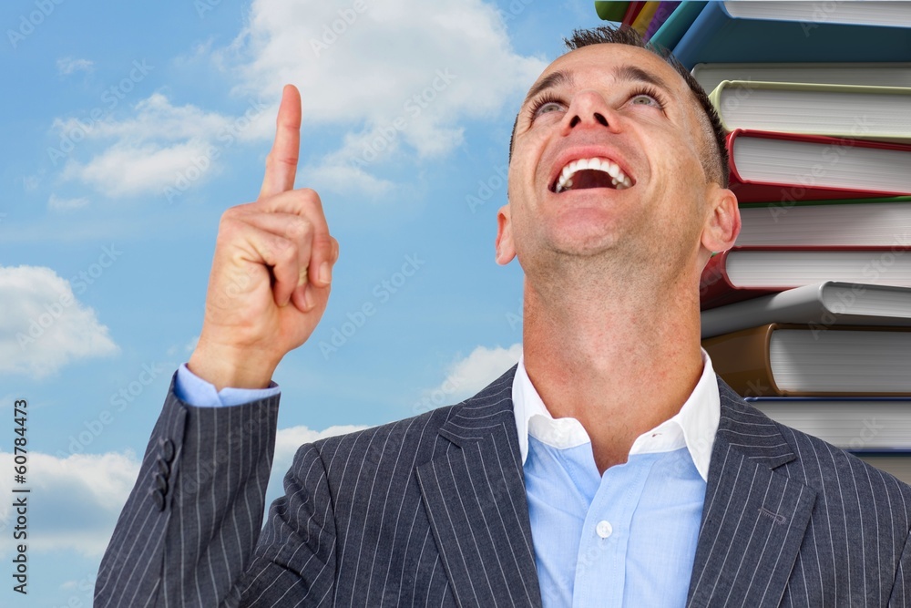 Poster composite image of cheerful businessman pointing upward