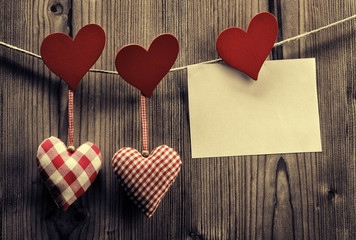 Valentine's Day Textile hearts hanging on the rope 