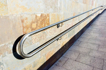 metal railings on slope of pedestrian walkway