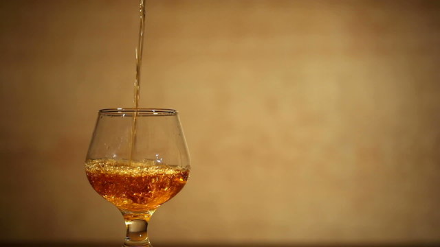 Cognac, brandy with ice is poured . Left side