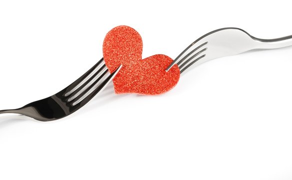 decorative red heart near forks, valentine day dinner