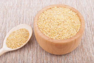 Fototapeten Wheat cereal in a bowl. © dibas99
