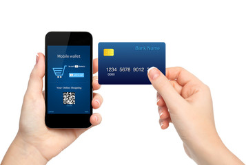 female hands holding phone and credit card making a purchase onl