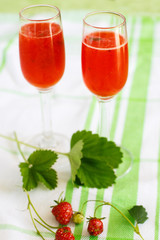Summer cocktail with champagne, peppermint and fresh strawberrie