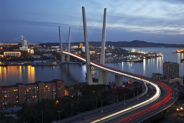 Fototapeta premium Panorama of night Vladivostok. Golden bridge. Russia