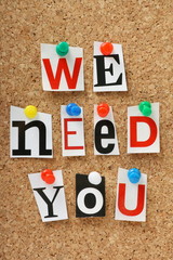 We Need You on a cork notice board