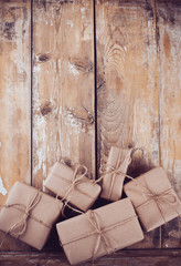 Obraz na płótnie Canvas gift boxes, postal parcels on wooden board