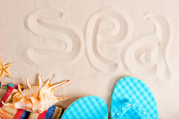 sea ​​inscription on the fine sands and beach paraphernalia