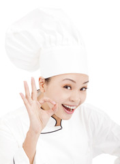 Pretty woman chef baker or cook showing ok hand sign