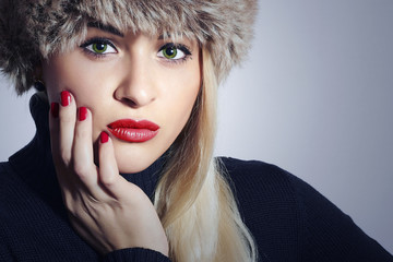 Beautiful Blond Woman in Fur.Girl with Green Eyes and Red Lips