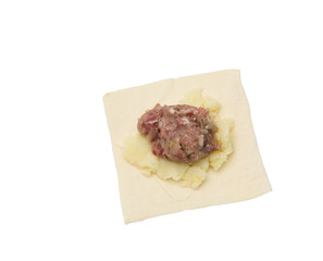 dough with meat on a white background