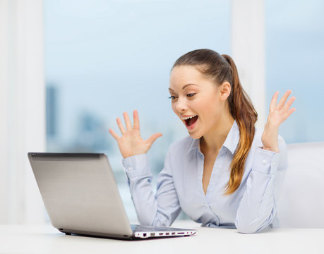 surprised businesswoman with laptop