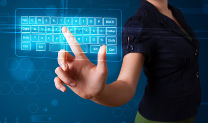 Girl pressing virtual type of keyboard