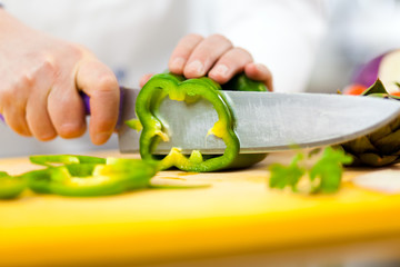 Chef slicing vegetables