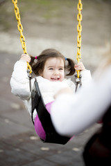 Little girl at the swing