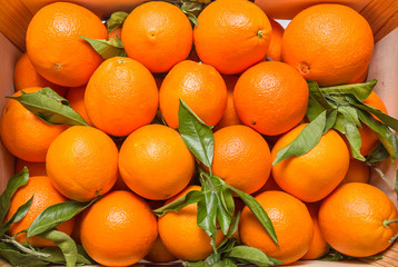 Tasty valencian oranges on a wooden box