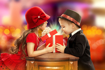 Happy children opening magic gift