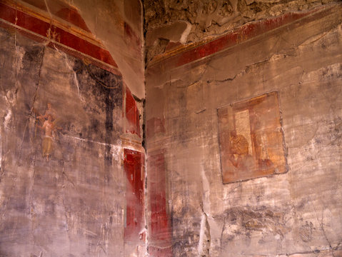 Ruined fresco in the once buried city of Pompeii Italy