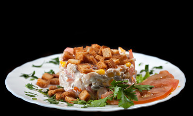 Tasty hearty salad with vegetables and croutons