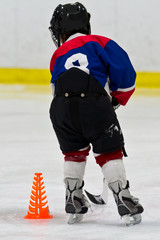 Fototapeta premium Young hockey player at practice