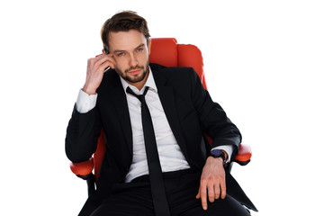 Fototapeta premium Worried businessman chatting on his mobile