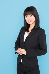 asian businesswoman on blue background