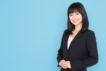 Obraz premium asian businesswoman on blue background