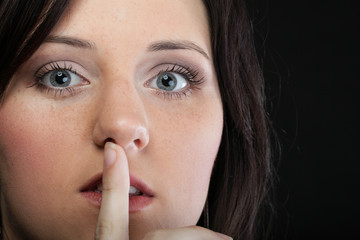 Young girl asking for silence