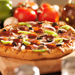supreme italian pizza with pepperoni and toppings