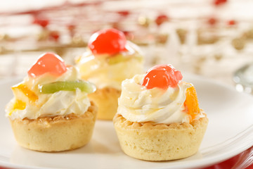 Small fruit tart with vanilla frosting