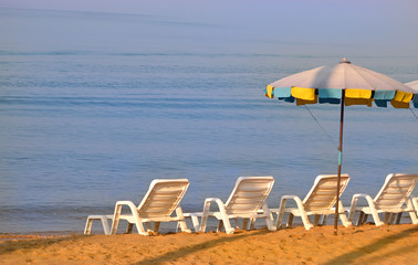 Sun chairs and umbrella, Pattaya, Thailand