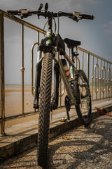 a bicycle parked on the walkway