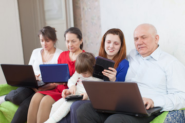 Fototapeta premium family uses few portable computers