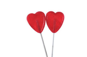 couple of red heart shape lollipops in love concept