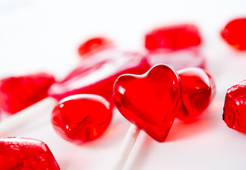 red love heart with chocolates and lolly pops