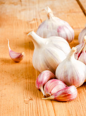 Raw Garlic On Wooden Background
