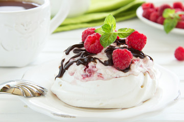 Meringue with raspberry cream, raspberry and chocolate.