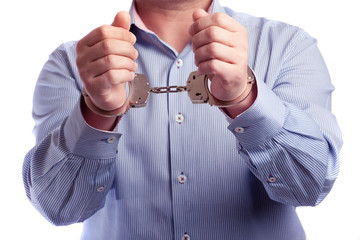 Close up of a man in handcuffs arrested