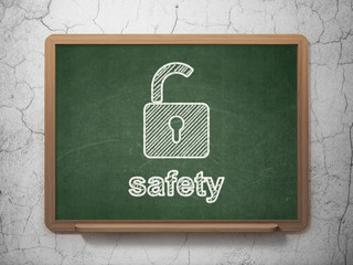 Security concept: Opened Padlock and Safety on chalkboard