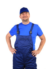 Worker in blue overalls.