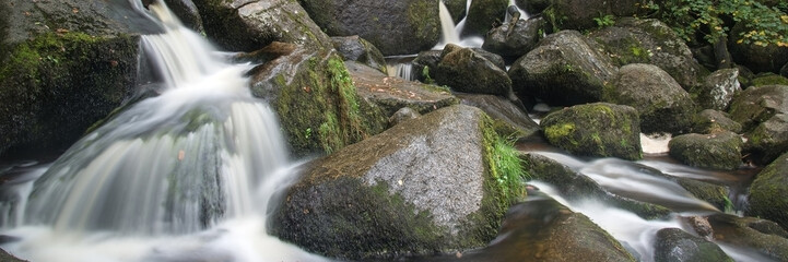 Panorama format landscape of waterfall in forest