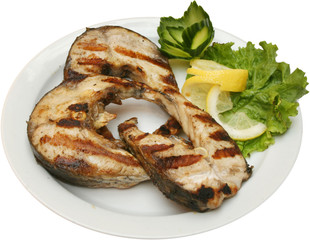 Grilled fish fillet on BBQ with vegetables 