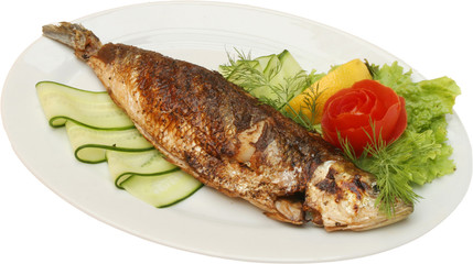 Grilled fish on BBQ with vegetables