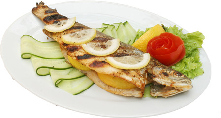 Grilled fish on BBQ with vegetables and salad