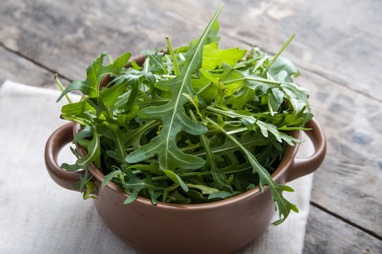bowl of green salad with arugula
