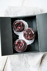 Valentine's Day chocolate cupcake   decorated  with cream in the