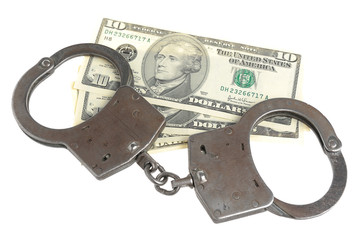 Handcuffs and money isolated on white background