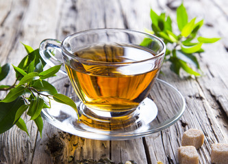 Transparent cup of green tea